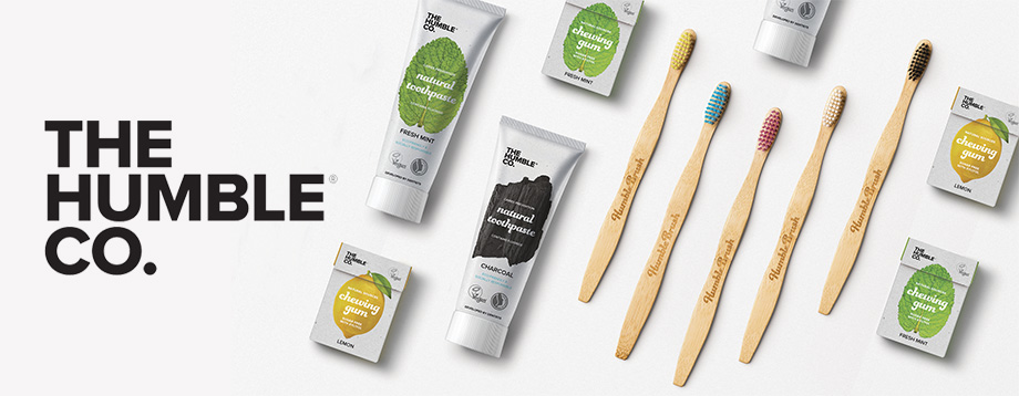Promotional materials for The Humble Co. showcasing several bamboo toothbrushes. 