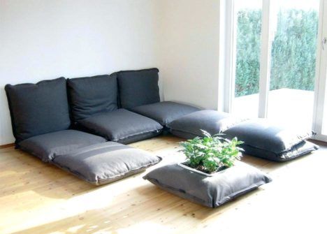 A "couch" composed of nothing but floor cushions - a hallmark of the furniture-free lifestyle.
