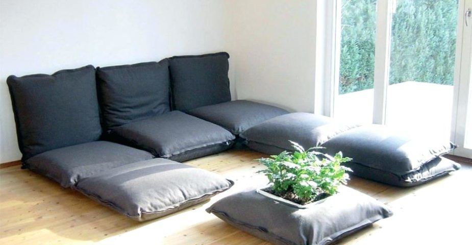 A "couch" composed of nothing but floor cushions - a hallmark of the furniture-free lifestyle.