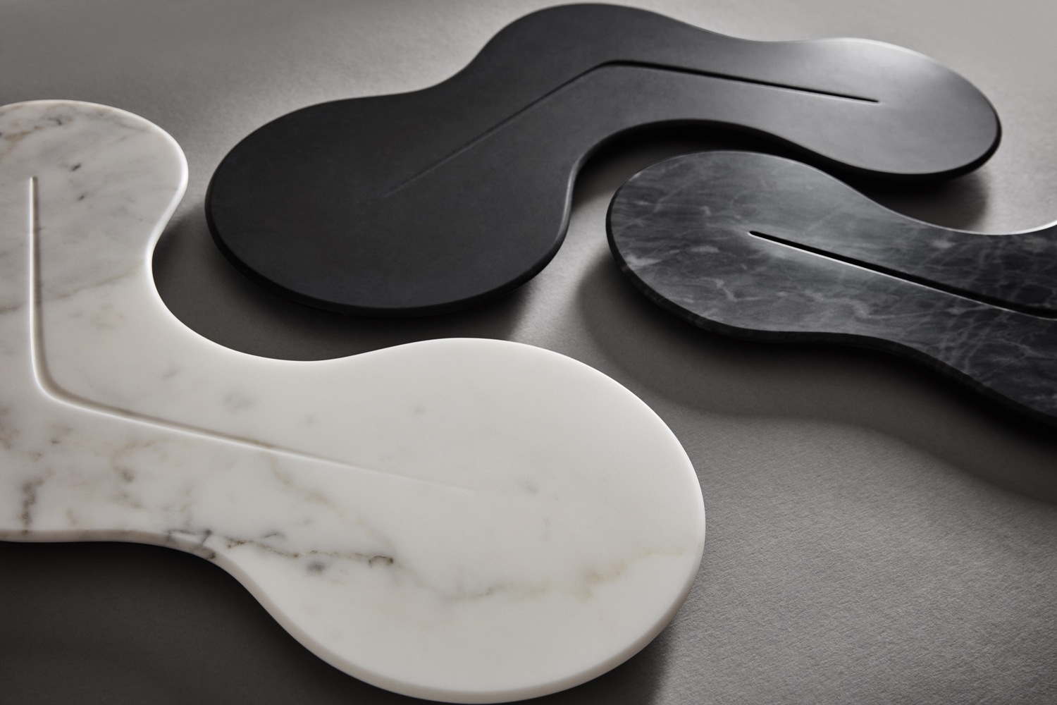 The black-and-white marble platters featured in Zaha Hadid Design's new kitchenware collection. 