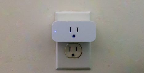 The Amazon Smart Plug plugged into a wall socket.