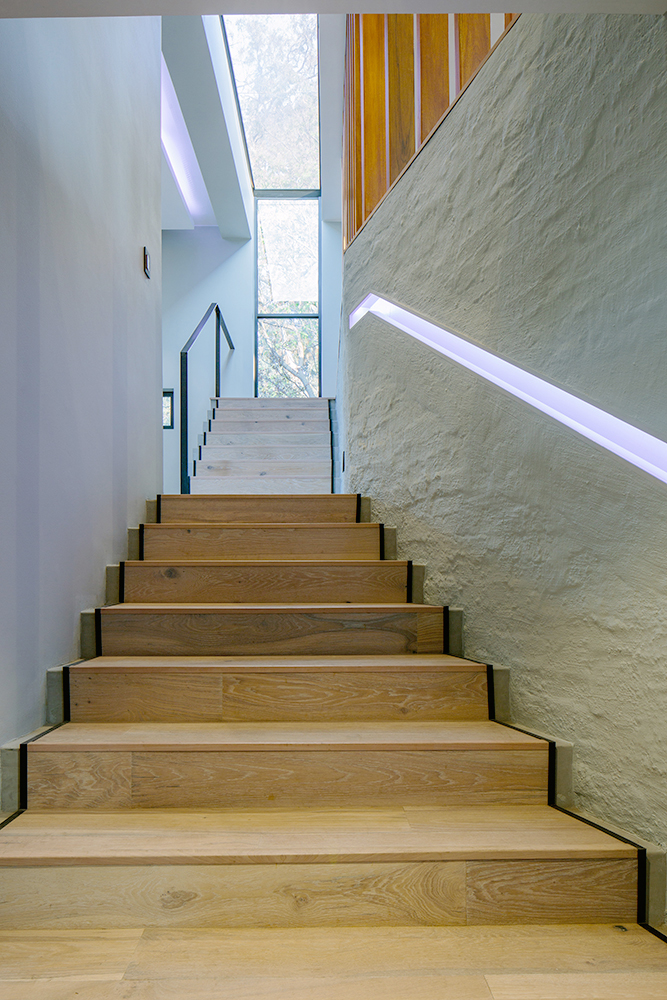 Staircase inside a modern residence on Johannesburg's Westwold Way. Designed by MMA Studio.