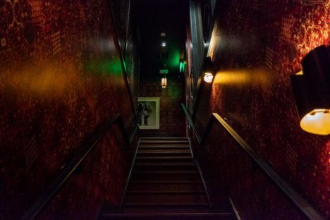 The dimly-lit staircase leading down to Bar Bevy.