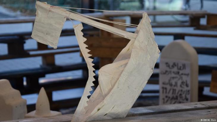 Small wooden sailboat crafted for the Human Cargo Art Project.