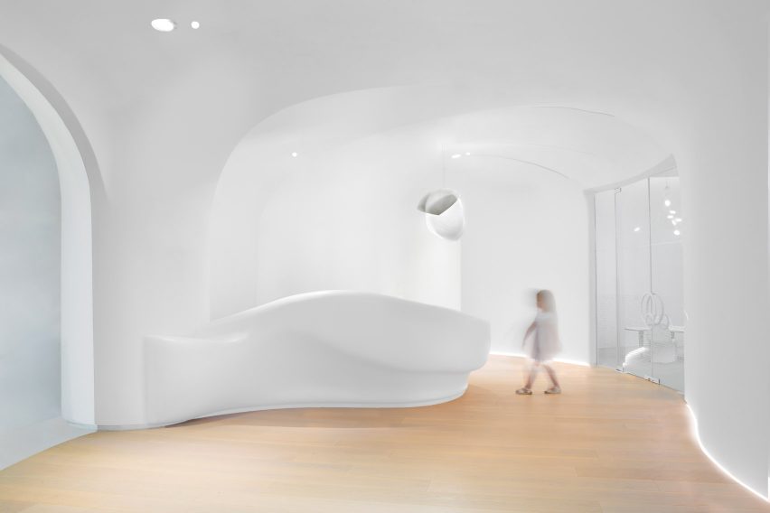 The curving all-white interiors of the new Ora nursery school.