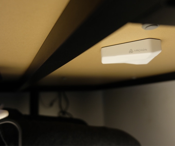 Under-the-table shot of the Archon invisible wireless charger.