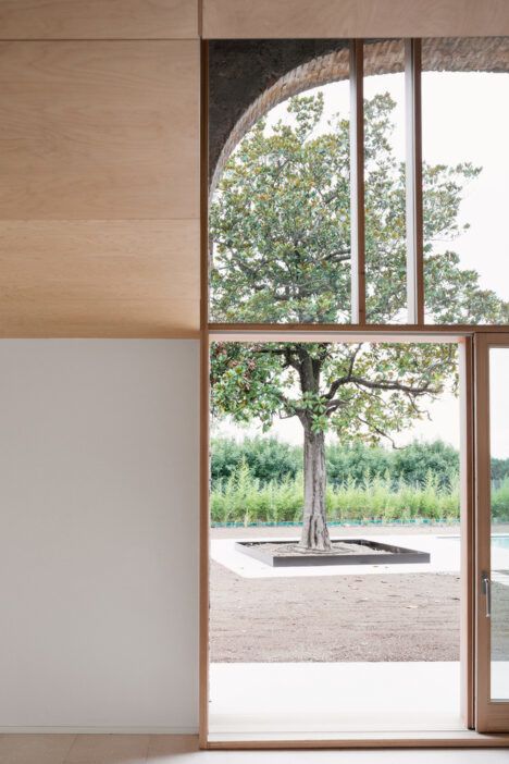 Close-up of the Country Home in Chievo's operable glazing, which itself leads out to a garden and swimming pool.