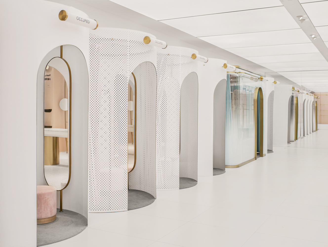 A row of fitting room pods inside Shanghai's new online-meets-offline Heyshop. 