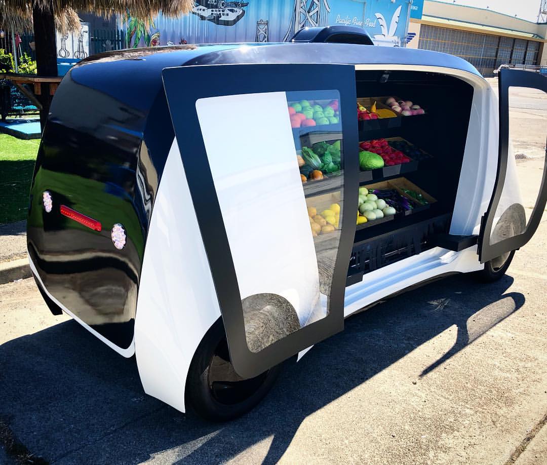 Side view of a Robomart self-driving grocery store on wheels. 