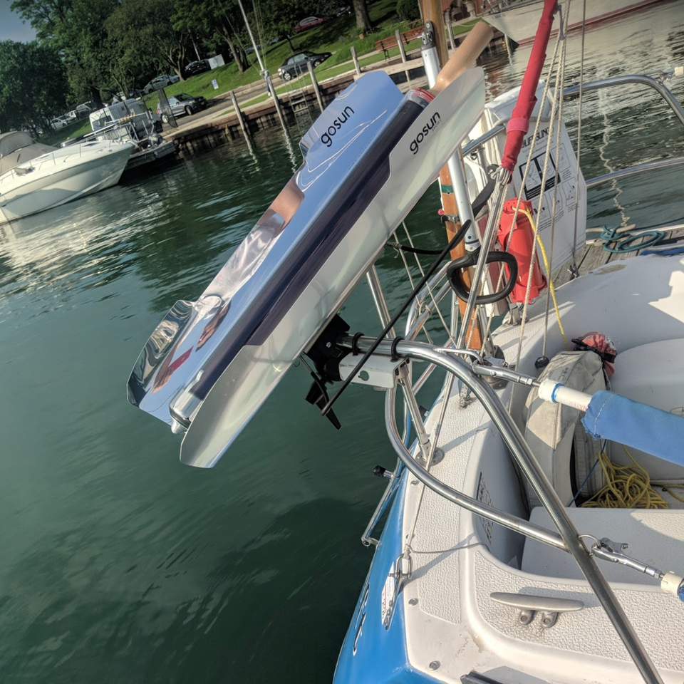 A GoSun solar cooker mounted and cooking on the back of a boat. 