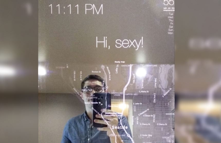 Man uses voice commands to communicate with his Microsoft smart mirror. 