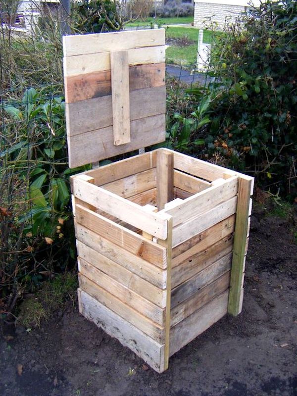 A DIY compost bin made from wooden pallets. 