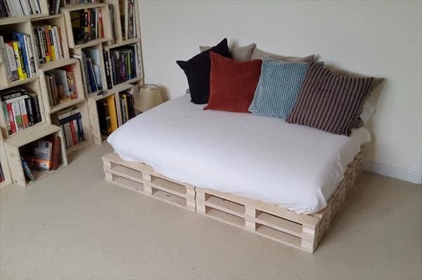 A DIY sofa bed made from upcycled wood pallets. 