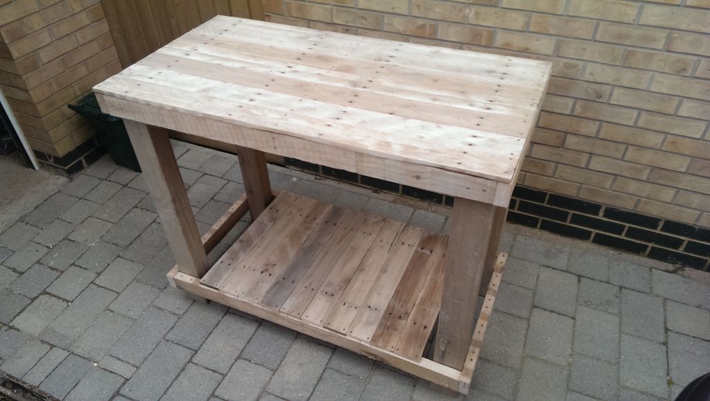 A DIY workbench made from upcycled wood pallets. 