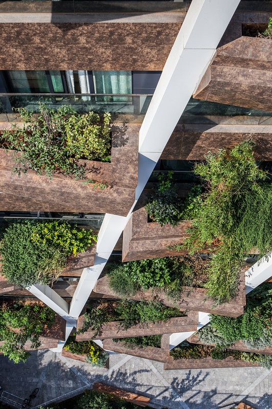 Shot of the GREENOX Residence's exterior vertical forest, as seen from the top of the building.
