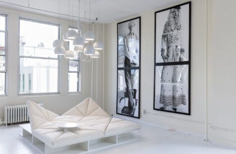One of furniture designer Pierre Paulin's modern chairs sits in the middle of a white living area.
