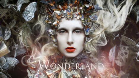 Promotional poster for Kirsty Mitchell's "Wonderland" photography series.