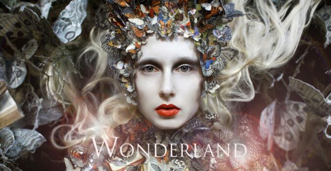 Promotional poster for Kirsty Mitchell's "Wonderland" photography series.