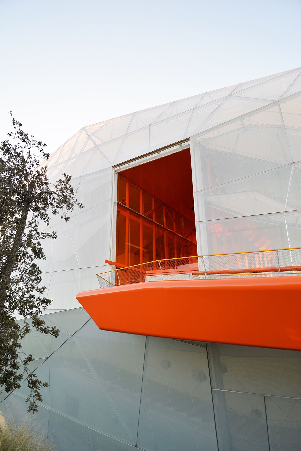 The main entrance to the new Plasencia Conference Center and Auditórium, as accessed by a bright orange walkway.