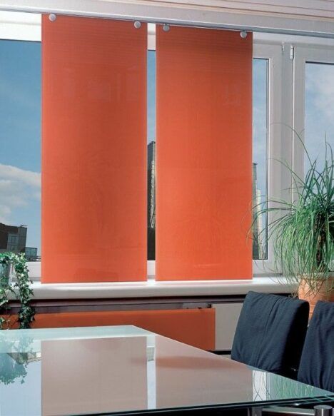 Sprinz' ultramodern glass curtains, pictured here in bright orange.