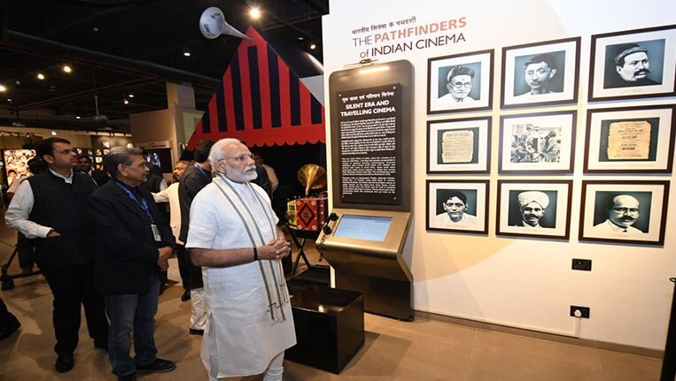 Indian Prime Minister Narendra Modi strolling through the exhibits at Mumbai's new National Museum of Indian Cinema. 