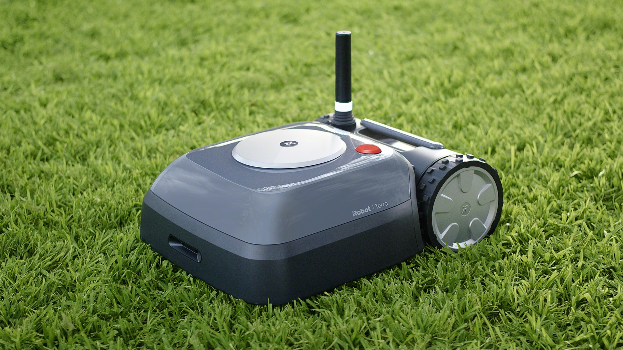 Terra, the new robotic lawn mower from iRobot, mowing a green lawn. 