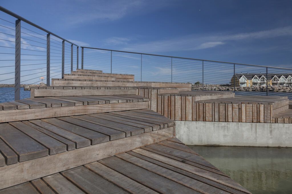 The sleek wooden decks that make up the Hasle Harbour Bath.