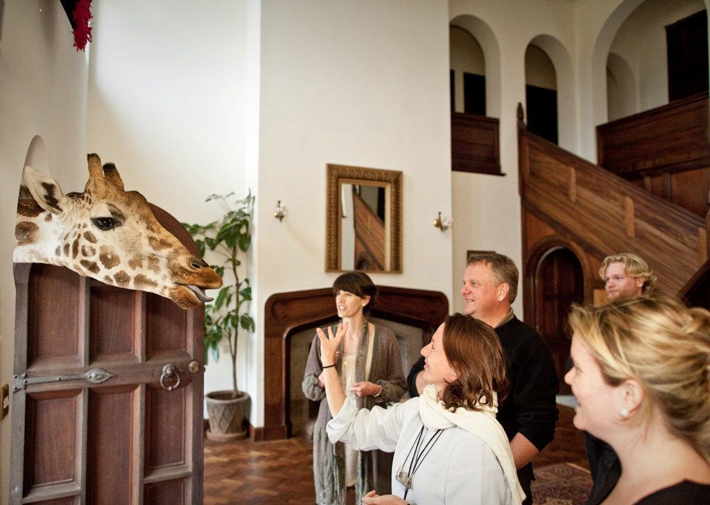A Rothschild giraffe pokes his head through a doorway in Nairobi's Giraffe Manor.
