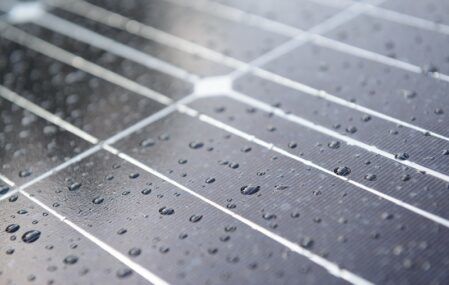 Solar panels coated with raindrops.