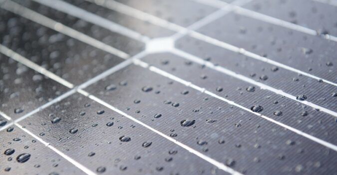 Solar panels coated with raindrops.