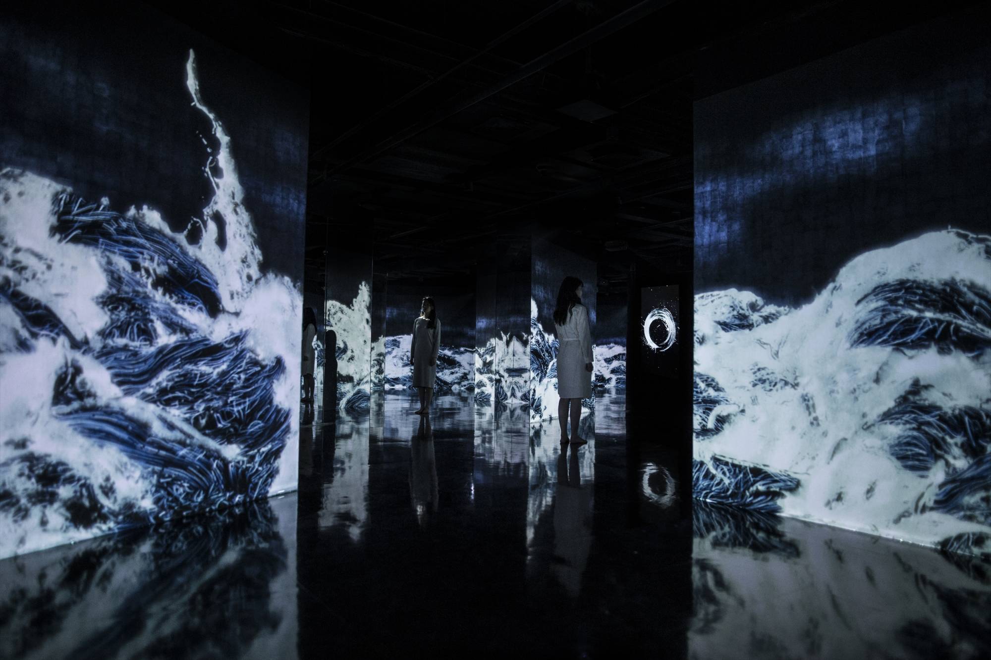 Stills from "Universe of Water Particles in the Tank," a new art installation from teamLab set inside reclaimed oil tanks.