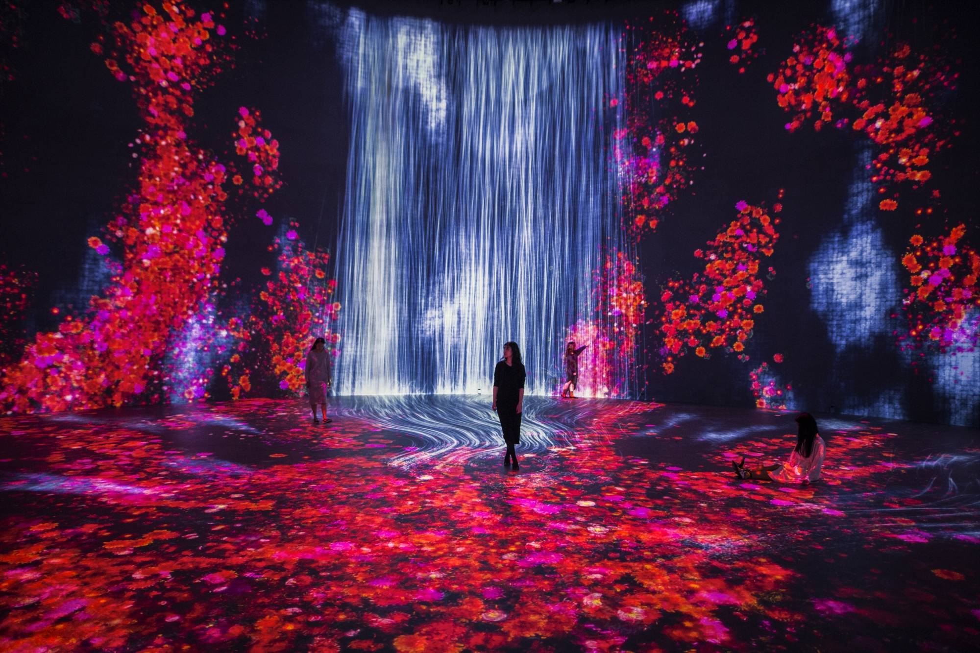 Stills from "Universe of Water Particles in the Tank," a new art installation from teamLab set inside reclaimed oil tanks. 