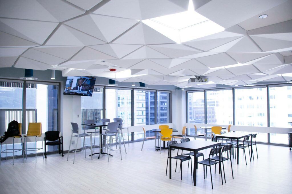 TURF Design's crease ceiling tile system hanging over an office space.