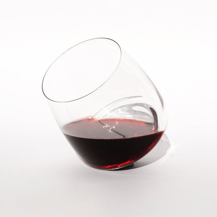tilted red wine saturn glass
