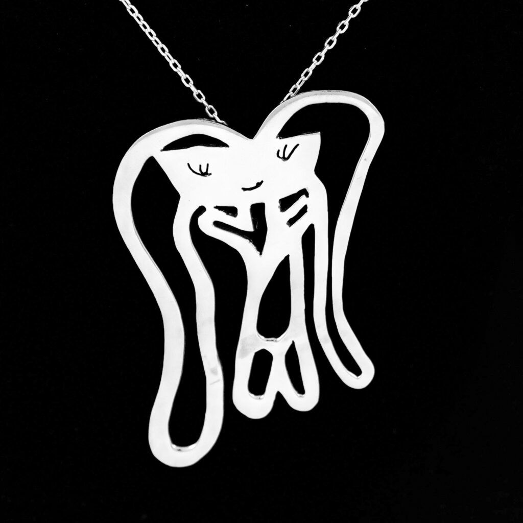 The same kid's drawing after being turned into a silver necklace by Tasarim Takarim.