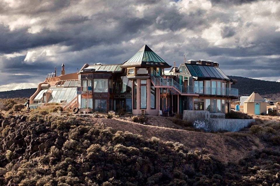 An elaborate earths house set in a desert climate.