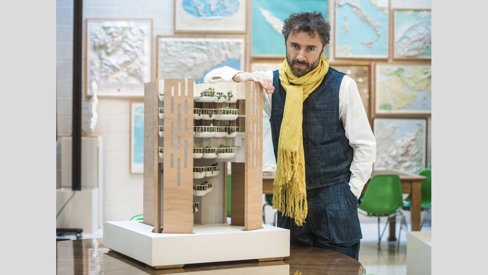 Designer Thomas Heatherwick stands next to a miniature "Eden" model.
