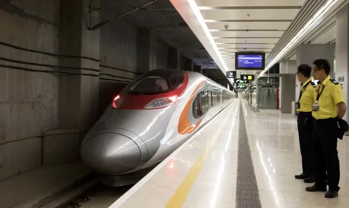A high-speed train pulls into West Kowloon Station