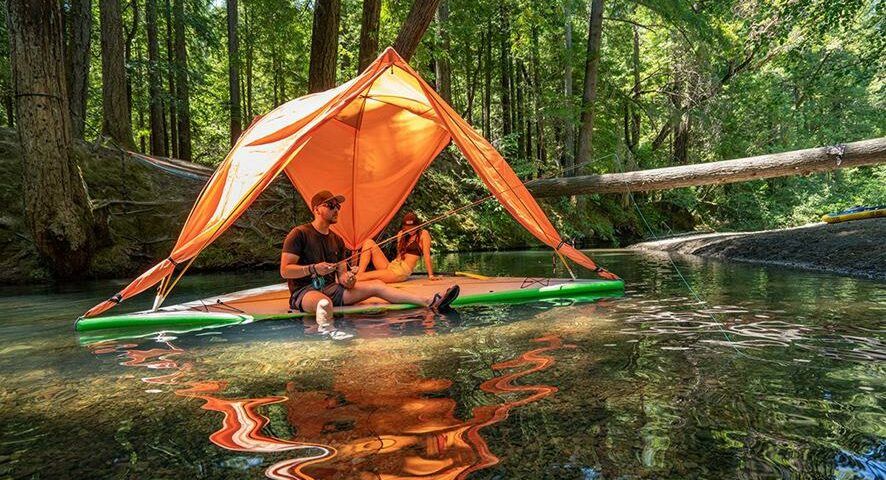 A family uses the Universe 5-Person Tree Tent as a floating diving board.