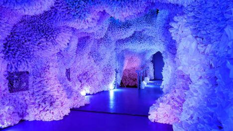 ocean cave art installation with purple and blue hues