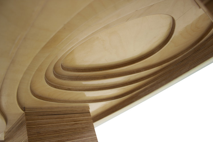 The carved wood detail used to create the Robben Island Coffee Table's many contours