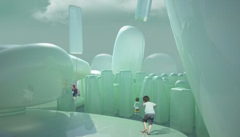 kids playing in a green inflatable plastic art installation