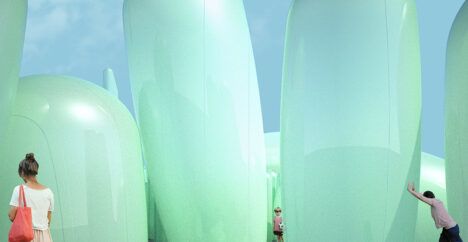 people exploring inside green inflatable plastic art installation