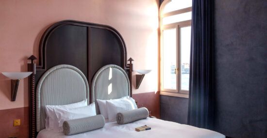 A bedroom inside Venice's Hotel Il Palazzo Experimental