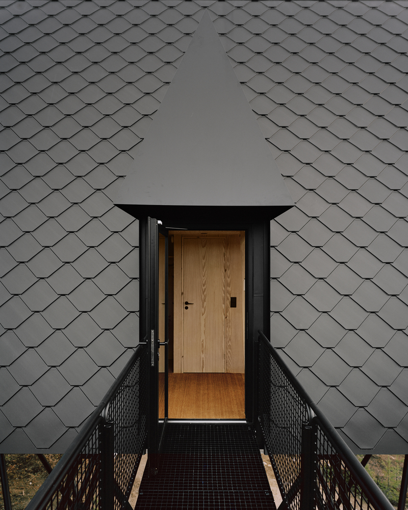 Entrance to one of Norway's stark black PAN-cabins