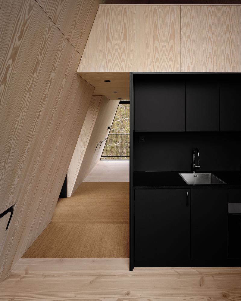 The cozy interior of Norway's stark black PAN-cabins